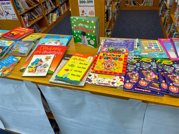 Free books were also part of the Holiday Shop display as parents and families could take books home to their kids.